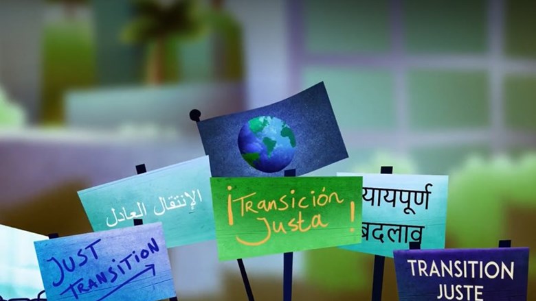 illustratie van bordjes met Just Transition in verschillende talen